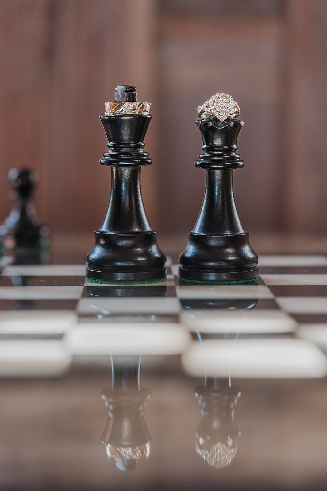 Wedding rings on chess king and queen pieces