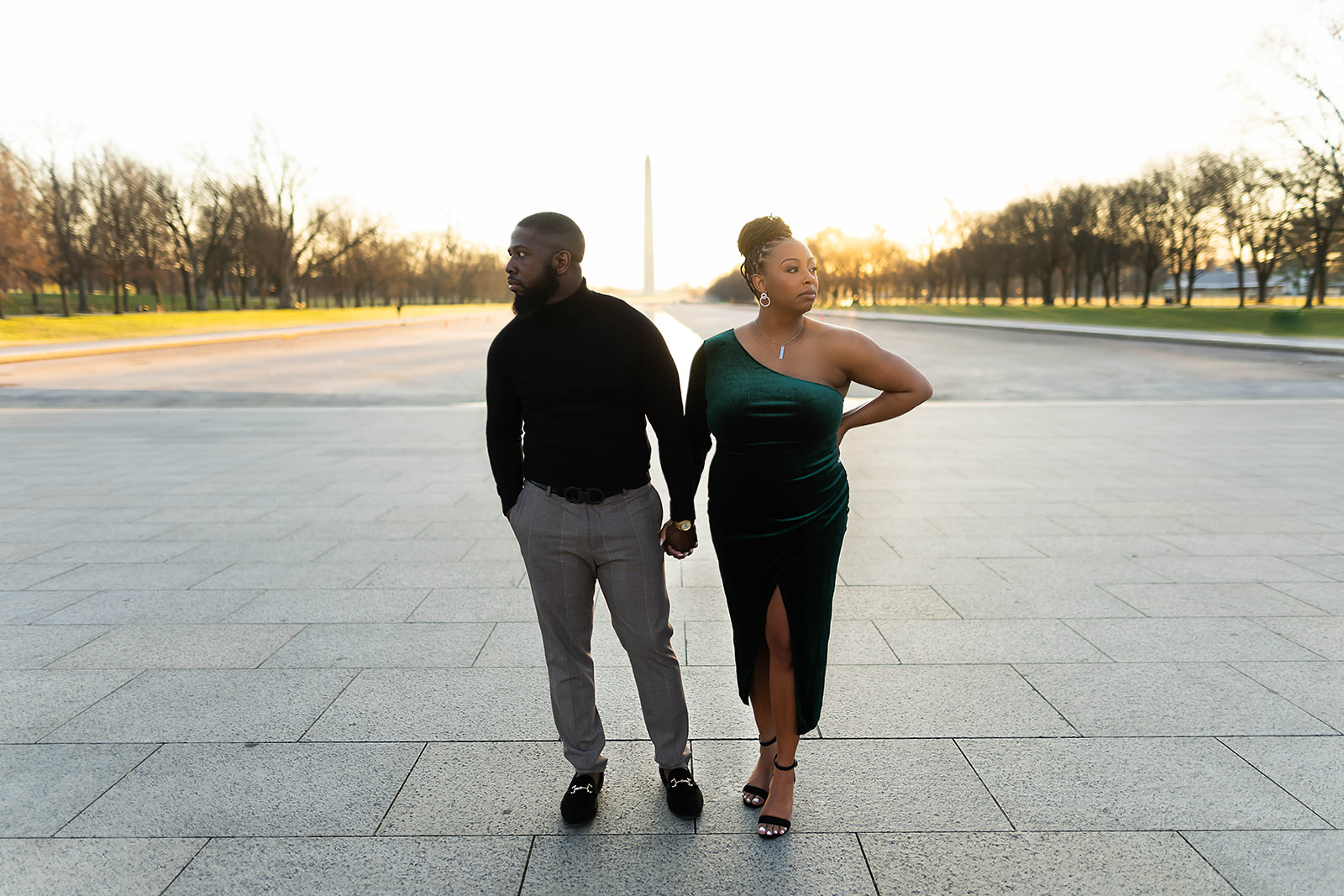 Couple at Washington Monument in green velvet dress at sunset