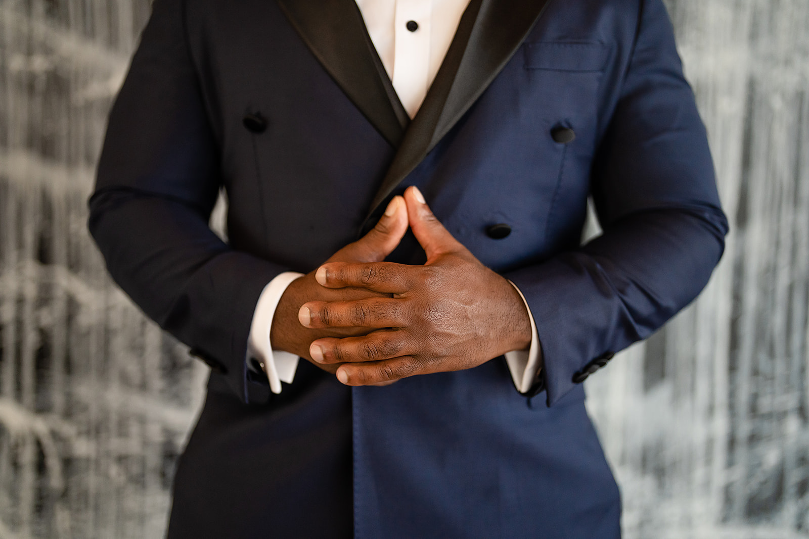 Groom hands tuxedo detail closeup