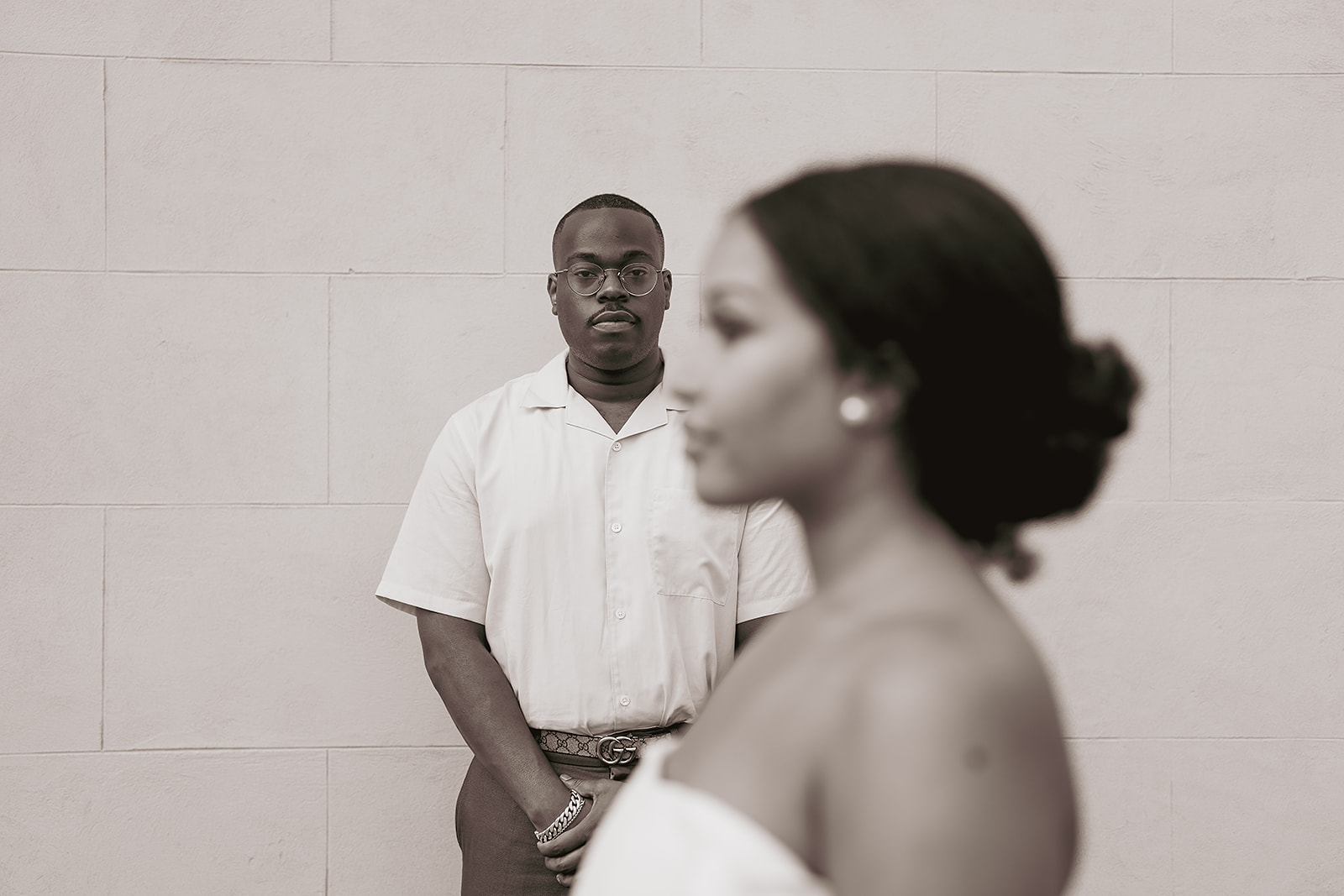 Man with glasses focus shift black and white portrait