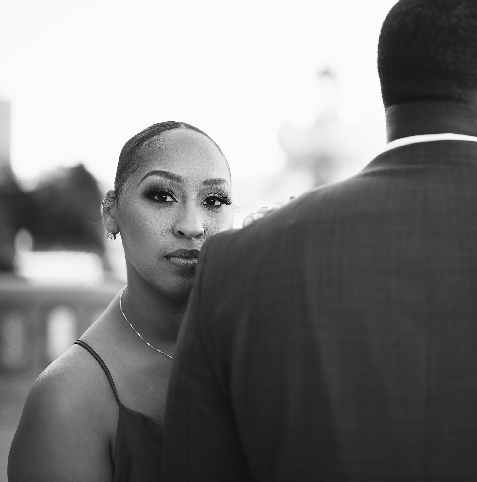 Woman glancing over shoulder black and white portrait