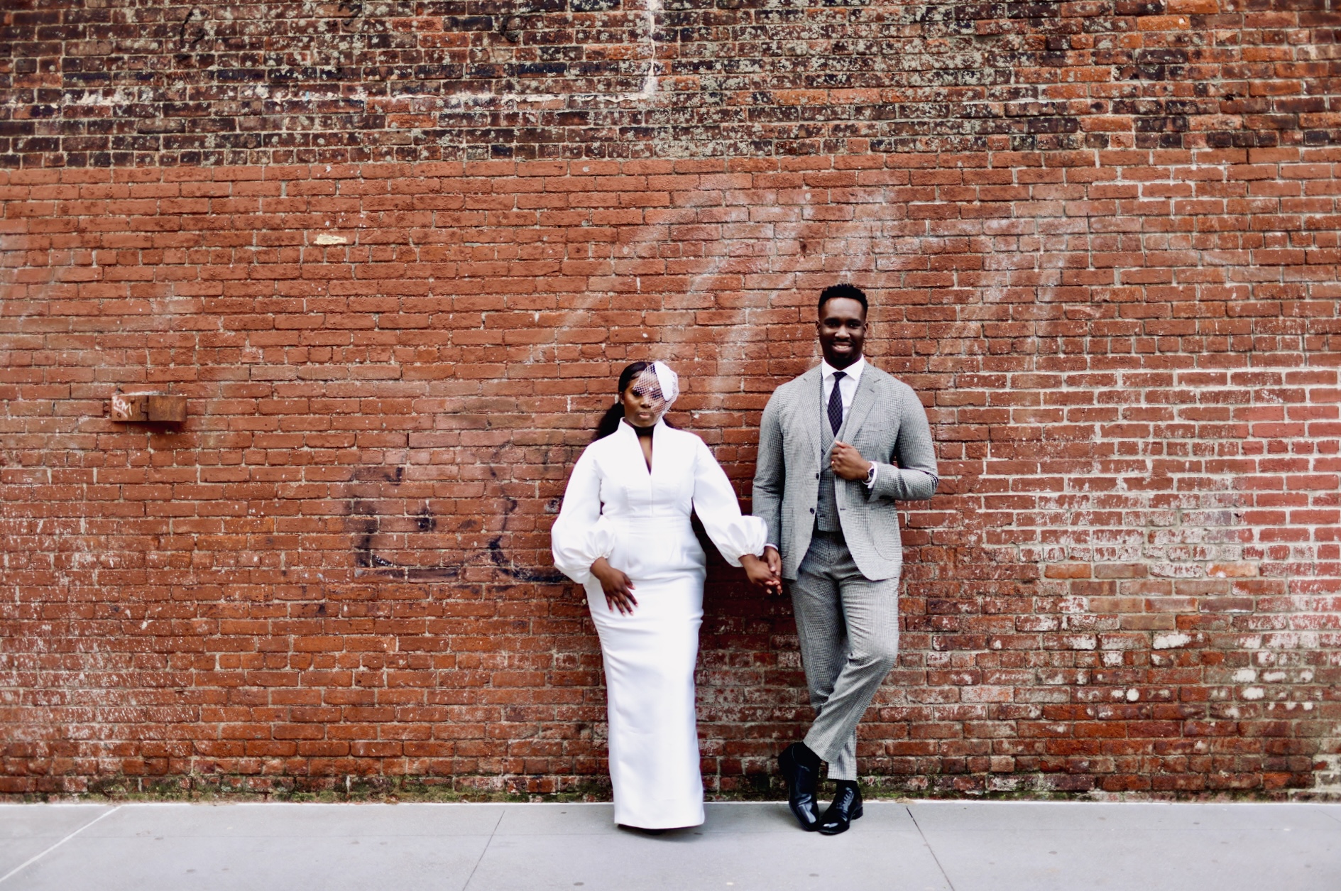 Couple at brick wall urban editorial