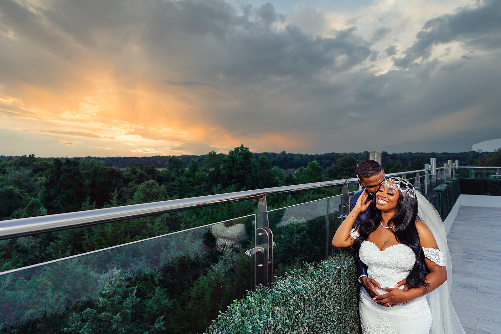 Wedding couple on rooftop at sunset